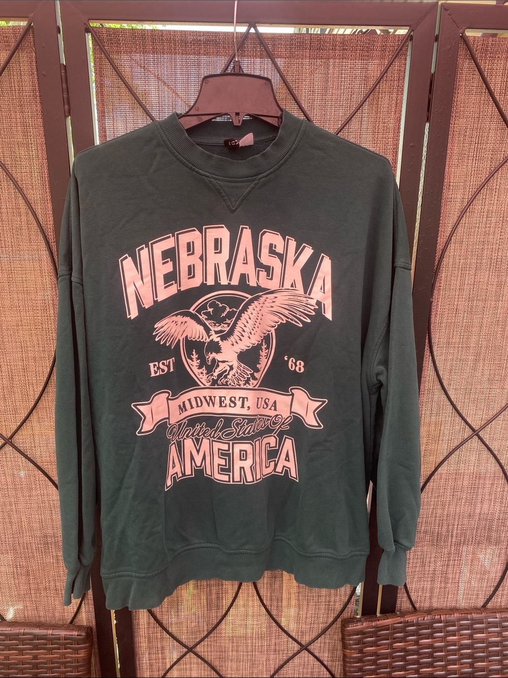 Divided Dark Green Sweatshirt with Pink Nebraska Graphic